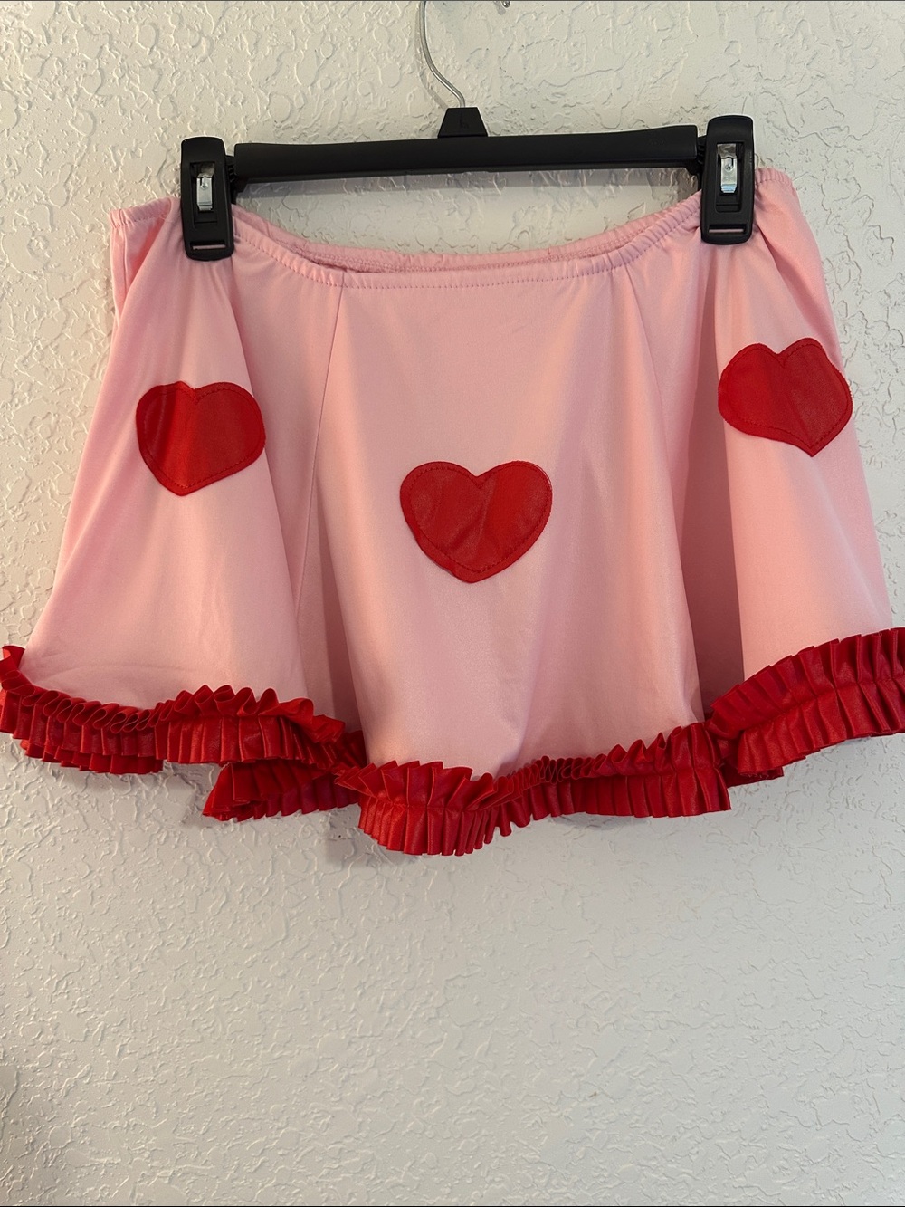 This pink and red heart-patterned mini skirt